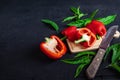 Bell pepper cut in half on a wooden cutting board on a black background. Royalty Free Stock Photo