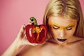 Bell pepper in hand of woman with creative fashionable makeup Royalty Free Stock Photo
