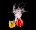 Bell pepper making splash in water.