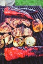 Bell pepper, onion and meat on grill