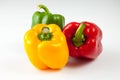 Bell peppers over white background, Green, yellow and red Fresh Royalty Free Stock Photo