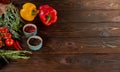 Bell peppers, rosemary, cherry tomatoes and other ingredients for cooking on wooden rustic background top view Royalty Free Stock Photo