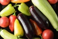 Bell peppers, tomatoes, zucchini, vegetables spread out on a black baking sheet Royalty Free Stock Photo