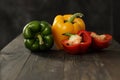 Bell peppers tricolor, dark background on black table Royalty Free Stock Photo