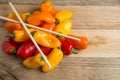 Bell peppers on a weatherd wood background.