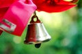 Bell with a ribbon. Last call. A bell with a red ribbon. Spring holiday. School years. Graduation. School bells on the background