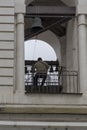 bell-ringer at work on belfry of Russian Orthodox church