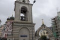 bell-ringer at work on belfry of Russian Orthodox church