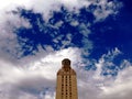 The bell tower in California University under blue cloudy sky background