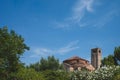 Bell tower of Cathedral of Santa Maria Assunta and Church of Santa Fosca over trees in Torcello, Venice, Italy Royalty Free Stock Photo