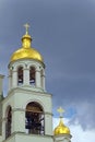 The bell tower of the church a background of storm clouds Royalty Free Stock Photo