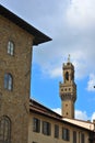 Bell tower and clock of the Palazzo Vecchio on the Piazza della Signoria in Florence, Tuscany, Italy. Blue sky in background. Royalty Free Stock Photo