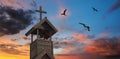 A Bell Tower with Cross and Nighthawks