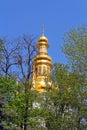 Bell tower of distant caves hidden in the spring foliage, Kyiv