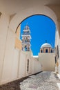 Bell tower and dome of the Saint John the Baptist church in the city of Fira in the Island of Santorini Royalty Free Stock Photo