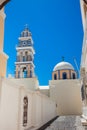 Bell tower and dome of the Saint John the Baptist church in the city of Fira in the Island of Santorini Royalty Free Stock Photo
