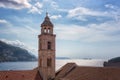 Bell tower of Dominican Monastery in Dubrovnik against beautiful blue cloudy sky and Adriatic sea, Croatia Royalty Free Stock Photo