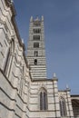 Bell tower of Duomo di Siena or Metropolitan Cathedral of Santa Maria Assunta. Tuscany. Italy. Royalty Free Stock Photo