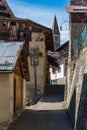 Bell tower of Italian mountain chapel in small village. Region Trentino, Italy.