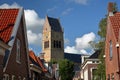 The bell tower of Martinikerk (St Martin church) viewed from Kerkstraat street in Bolsward, Friesland, Netherlands Royalty Free Stock Photo