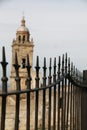 Bell tower of the Mayor church of Medina Sidonia behind the gates, in Spain Royalty Free Stock Photo