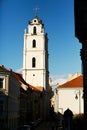 Bell tower in the morning light in Vilnius on background blue sk