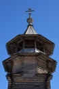 Bell tower with octagonal tent of ancient wooden Church of Annunciation of Blessed Virgin Mary in Annunciation village, courtyard