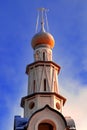 Bell tower of Orthodox Church in Russia against blue sky Royalty Free Stock Photo