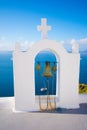 Bell tower of an orthodox church at Santorini, Greece. Honeymoon summer aegean cycladic background. Royalty Free Stock Photo