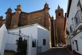 Bell tower and rear facade of the Divino Salvador church in the magical Andalusian town of Cortegana, Huelva, Spain