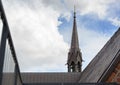 Bell tower on the roof of the st. georgen church against a cloudy sky with copy space