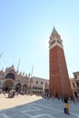 Bell tower St Mark`s Campanile and cathedral church St Mark`s Basilica at Saint Mark`s Square Piazza San Marco in Venice, Ita Royalty Free Stock Photo