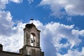 Bell tower with a stork nest in Trujillo town