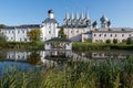 The bell tower of the Tikhvin Assumption Bogorodichny Uspensky   Monastery with a reflection in the pond. Tikhvin Royalty Free Stock Photo