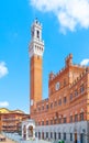 Bell tower, Torre del Mangia, of the Town Hall, Palazzo Pubblico, at the Piazza del Campo, Siena, Italy Royalty Free Stock Photo