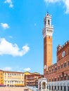 Bell tower, Torre del Mangia, of the Town Hall, Palazzo Pubblico, at the Piazza del Campo, Siena, Italy Royalty Free Stock Photo