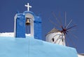 Bell tower and windmill in Oia village, Santorini, Greece Royalty Free Stock Photo