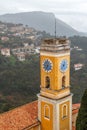 Bell-tower of a yellow church in Eze medieval village, Provence Royalty Free Stock Photo