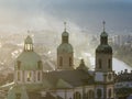 Bell towers of Cathedral of St. James in Innsbruck, Austria. Church Domes in Soaft Light at Foggy Evening sunset time