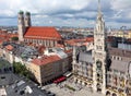 Bell towers of the Cathedral and the town hall in the gothic style of the city of Munich in Germany in the region Bavaria