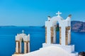Bell towers of greek church above the sea in Santorini