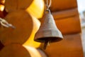 Bell on traditional russian village house made of logs. Authentic landscape. Soft focus Royalty Free Stock Photo