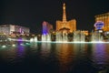 Bellagio Casino Water Show at night with Paris Casino and Eiffel Tower, Las Vegas, NV