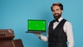 Bellboy shows greenscreen on laptop