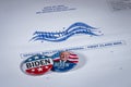 Belleville, ILÃ¢â¬âSept 30, 2020; Campaign buttons for democrat party candidate Joe Biden sit on a white and blue envelope marked as