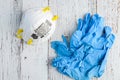 BELLEVUE, WA/USA Ã¢â¬â APRIL 30, 2020: PPE on a rustic white background, 3M N95 mask and blue nitrile gloves