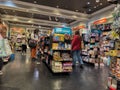 Bellevue, WA USA - circa December 2022: Wide view of people Christmas shopping for their children inside a toy store in the