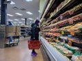 Bellevue, WA USA - circa December 2022: Wide view of people shopping in the refrigerated food section of a Trader Joes grocery Royalty Free Stock Photo