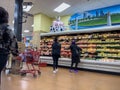 Bellevue, WA USA - circa December 2022: Wide view of people shopping in the refrigerated food section of a Trader Joes grocery Royalty Free Stock Photo