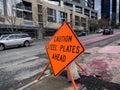 Bellevue, WA USA - circa February 2023: close up view of a Caution Steel Plates Ahead sign in the downtown area around a